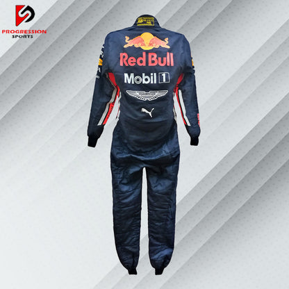 Step into the world of Formula 1 with the Red Bull racing suit. Known for its bold design and cutting-edge technology, this suit reflects the dynamic spirit of one of F1's most successful teams. Ideal for collectors and fans, it represents a blend of style, innovation, and racing excellence. Own a piece of Red Bull's racing legacy and embrace the thrill of the track.