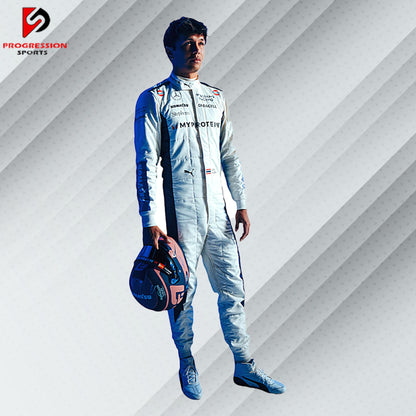 The 2024 Williams F1 racing suit features a striking combination of dark blue and white, accented with subtle red details. Crafted from advanced, lightweight, flame-resistant materials, it offers top-notch protection and comfort. Prominent Williams and primary sponsor logos adorn the suit, reflecting the team's rich history and modern design.