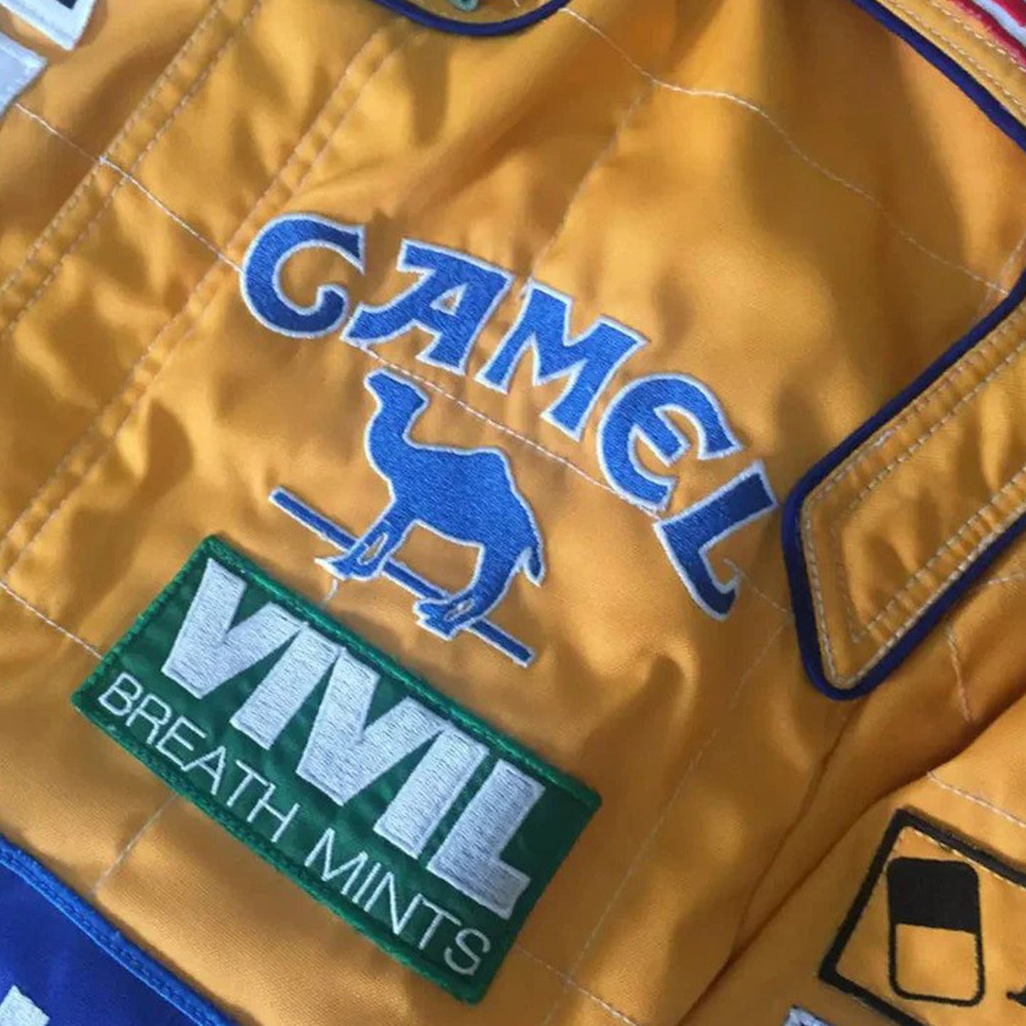 In 1992, Michael Schumacher appeared in F1 kit, sporting the Benetton Ford colours, its brightest shades of green, blue, and yellow, accompanied by a plethora of sponsors on the body. Once more the bodywork was named after Michael Schumacher. By this shirt we would like to let people taste the early days of the times of Michael Schumacher in Formula 1.