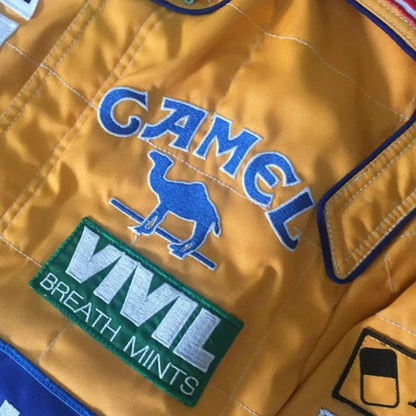 In 1992, Michael Schumacher appeared in F1 kit, sporting the Benetton Ford colours, its brightest shades of green, blue, and yellow, accompanied by a plethora of sponsors on the body. Once more the bodywork was named after Michael Schumacher. By this shirt we would like to let people taste the early days of the times of Michael Schumacher in Formula 1.