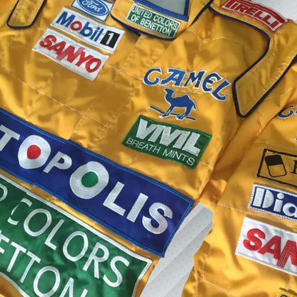 In 1992, Michael Schumacher appeared in F1 kit, sporting the Benetton Ford colours, its brightest shades of green, blue, and yellow, accompanied by a plethora of sponsors on the body. Once more the bodywork was named after Michael Schumacher. By this shirt we would like to let people taste the early days of the times of Michael Schumacher in Formula 1.