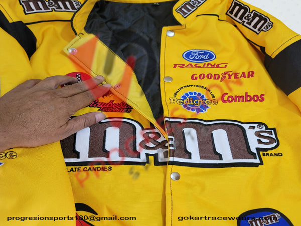 A NASCAR jacket is designed to reflect the high-octane energy of stock car racing. Typically crafted from durable, water-resistant materials, it features vibrant team colors and logos, including driver and sponsor patches. The jacket often includes practical elements such as adjustable cuffs, a zippered front, and multiple pockets for convenience. Whether worn at the track or as casual wear, it combines style and functionality, celebrating the excitement of NASCAR racing.